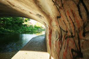 Graffiti sprayed on underside of canal bridge